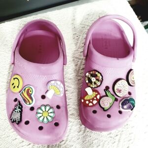KIDS PREOWNED PINK CROCS WITH TOGGLES/ CHARMS. C12